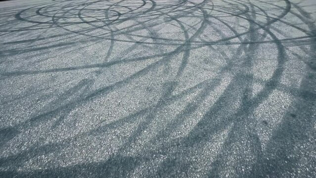 Traces of car tires on the asphalt after drifting.