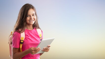 a happy little school girl posing