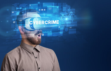 Businessman looking through Virtual Reality glasses