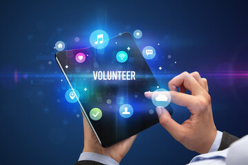 Businessman holding a foldable smartphone