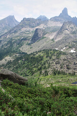 View from the mountain pass to highest rocky peaks of Ergaki National Park. Siberia, Krasnoyarsk region, Russia.