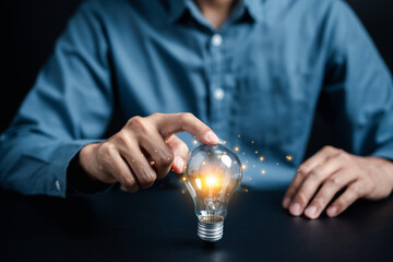 Businessman holding light bulb with business target planning idea and creativity innovation...