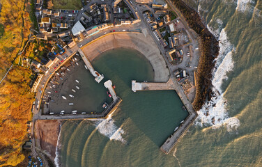 Stonehaven harbour and town at sunrise during the summer