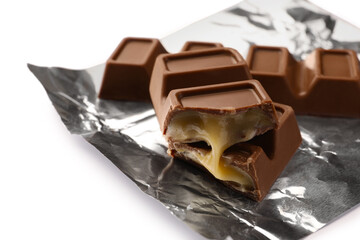 Delicious sweet chocolate bars on white background, closeup