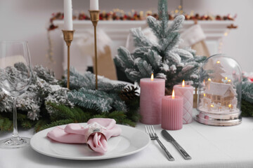 Beautiful festive table setting with Christmas decor in room