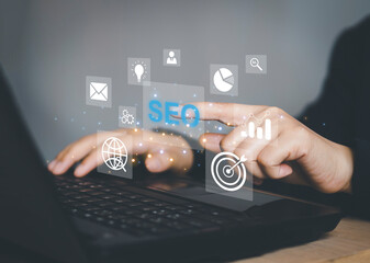 Businessman using a computer for analysis SEO Search Engine Optimization Marketing Ranking Traffic Website Internet Business Technology Concept.