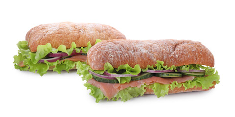 Delicious sandwiches with fresh vegetables and salmon isolated on white