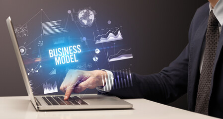 Businessman working on laptop, business concept