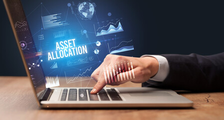 Businessman working on laptop, business concept