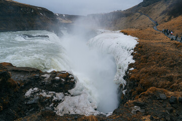 Gullfoss, located in Iceland, is a breathtaking two-tiered waterfall. The sheer power and beauty of the falls are mesmerizing, and the surrounding landscapes make for a perfect photo opportunity.