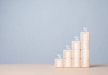 Finance investments economy and inflation concept. Wooden blocks with growth bar chart percentage sign, Idea for FED consider interest rate hike. Financial growth, interest rate increase. Tax rise.