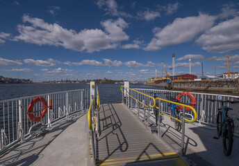 Front of harbor commuting ferry in the bay Strömmen, bikes and gangway on the front deck, a sunny...