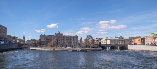 Naklejka premium Panorama over the stream Strömmen with troubled water, government houses and the house of foreign affairs, a sunny spring day in Stockholm