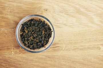 Tea in a bowl on a wood