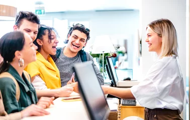 Young diverse friends having fun time at luxury hotel reception on check in time - Travel life style concept with happy people waiting at guesthouse desk on fancy vacation - Bright vivid filter © Mirko Vitali