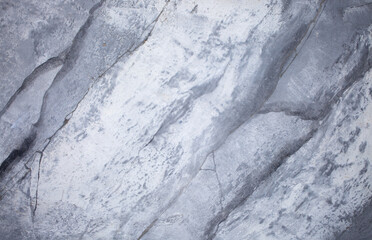 Background Stone wall background with abstract spots. Beautiful gray marble texture with stains, abstract surface background. Finishing stone for building cladding. Furniture granite.