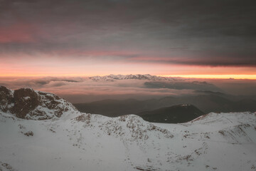 Moody winter sunset on the mountains of central Greece