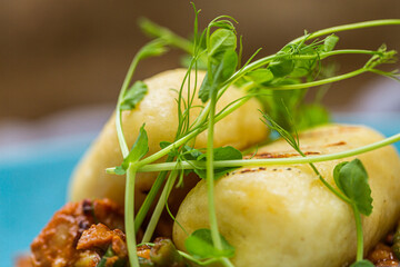 Hungarian goulash with a bread dumpling prepared on the grill. Close up
