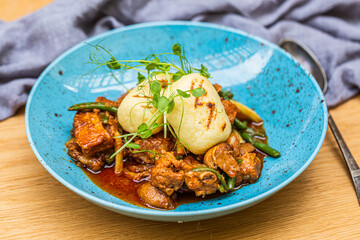 Hungarian goulash with a bread dumpling prepared on the grill. Close up