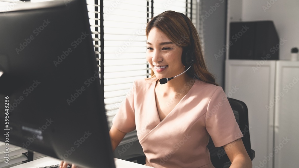 Poster competent female operator working on computer and while talking with clients. concept relevant to bo