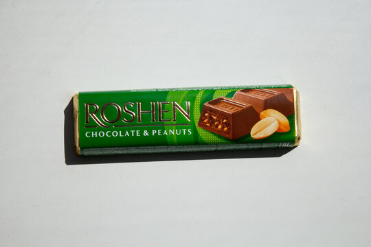 Zaporozhye, UKRAINE - APRIL 23, 2023: ROSHEN CHOCOLATE AND PEANUTS chocolate bar on a white background.