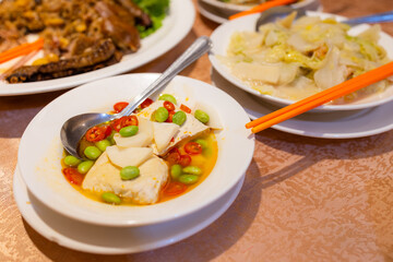 Chinese style stinky tofu with lots of others dishes in restaurant