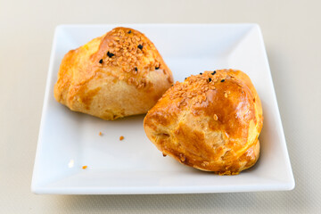 Turkish style meat stuffed filo dough borek served kol boregi. Cheese and minced pie are sliced on a marble background. Turkish name: Kol Boregi, ispanakli, kiymali, Su Boregi