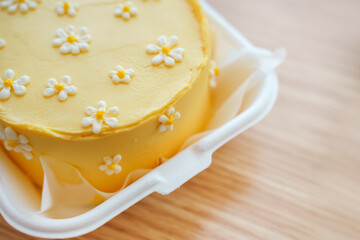 Beautiful cake with daisies made of cream and mastic, yellow summer cake