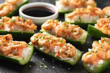 Cucumber Shrimp Sushi Boats with Spicy Mayo, Rice, Chives and sesame seeds