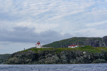 Fototapeta na wymiar Newfoundland, Canada: The Fox Point Lighthouse (Fishing Point), established in 1912 at the south entrance of St. Anthony Harbor.