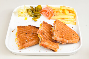 Turkish karisik atom Ayvalik tost ( kasarli bazlama tost) . Sucuklu, Kasarli, kavurmali karisik tost. Flat baked bread toasted