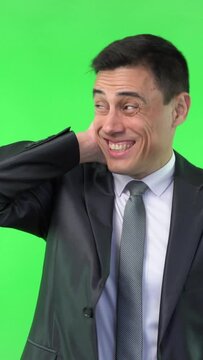 Shy man in formal wear touching head