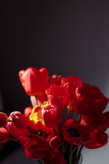 Natural bouquet of spring tulips. Red tulips on a smart white background. Valentine's day, mother's day, tenderness day, birthday concept. Soft selective focus. Spring scene. Greeting card.