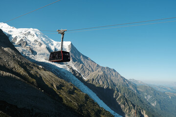 Cable car coach going to the Aiguille du Midi 3842 m mountain in the Mont Blanc massif , Chamonix, France - obrazy, fototapety, plakaty