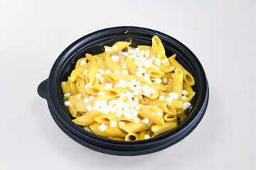 Macaroni Salad with red bell pepper, onion, celery, gherkins and mayonnaise dressing.Traditional Italian pasta with vegetables and creamy cottage cheese in a bowl. Fettuccini, alfredo makarna. 