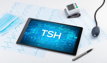 Close-up view of a tablet pc with medical abbreviation