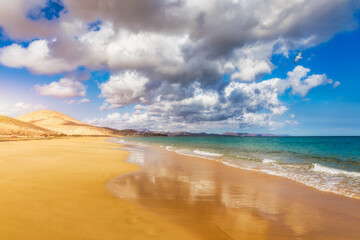 View on the beach Sotavento with golden sand and crystal sea water of amazing colors on Costa Calma on the Canary Island Fuerteventura, Spain. Beach Playa de Sotavento, Canary Island, Fuerteventura.
