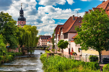 Fototapeta na wymiar Old city of Ettlingen in Germany with Alb river. View of a central district of Ettlingen, Germany, with Alb river. Ettlingen, Baden Wurttemberg, Germany.