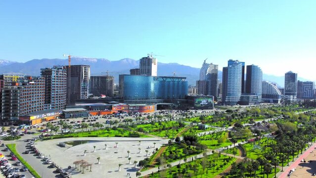 Batumi, Georgia - 2023: Aerial view of green park on sunny day against background of sea. Lehi and Maria Kaczynski Park in city. Beautiful green landscaping. Infrastructure,