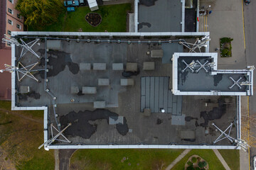 New GSM antennas on the roof of a residential building for transmitting a 5g signal are dangerous to health. Radiation pollution of the environment through cell towers. Flying a drone over the roof
