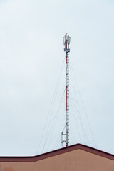 New GSM antennas on the roof of a residential building in the city for transmitting a 5g signal are a danger to human health. Radiation pollution of the environment through cell towers.