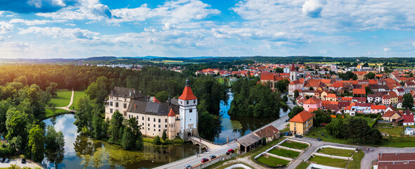 Blatna castle near Strakonice, Southern Bohemia, Czech Republic. Aerial view of medieval Blatna water castle surrounded parks and lakes, Blatna, South Bohemian Region, Czech Republic.