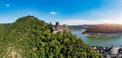 Katz castle and romantic Rhine in summer at sunset, Germany. Katz Castle or Burg Katz is a castle...