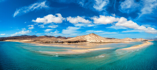 View on the beach Sotavento with golden sand and crystal sea water of amazing colors on Costa Calma on the Canary Island Fuerteventura, Spain. Beach Playa de Sotavento, Canary Island, Fuerteventura.