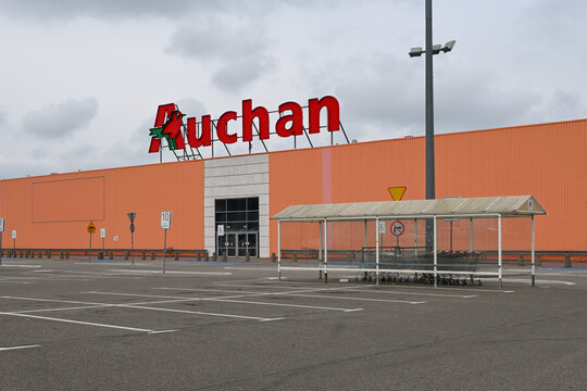 Rumia, Poland - April 16, 2023: Auchan logo on the facade of the store. Auchan is a French hypermarket chain