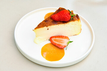 San sebastian ( Bask ) cheesecake slice isolated close up. Limon, lotus, fistikli, Frambuazli cheesecake