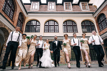 Joyful emotions of the bride and groom with friends