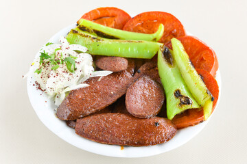 Grilled chili, tomato and sucuk between bread. ( Sucuk ekmek ) 