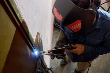 Men working. Person with face mask using welding. protection for welding work