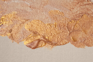 Oil and acrylic smear painting blot on canvas wall. Abstract gold, bronze, beige color stain...
